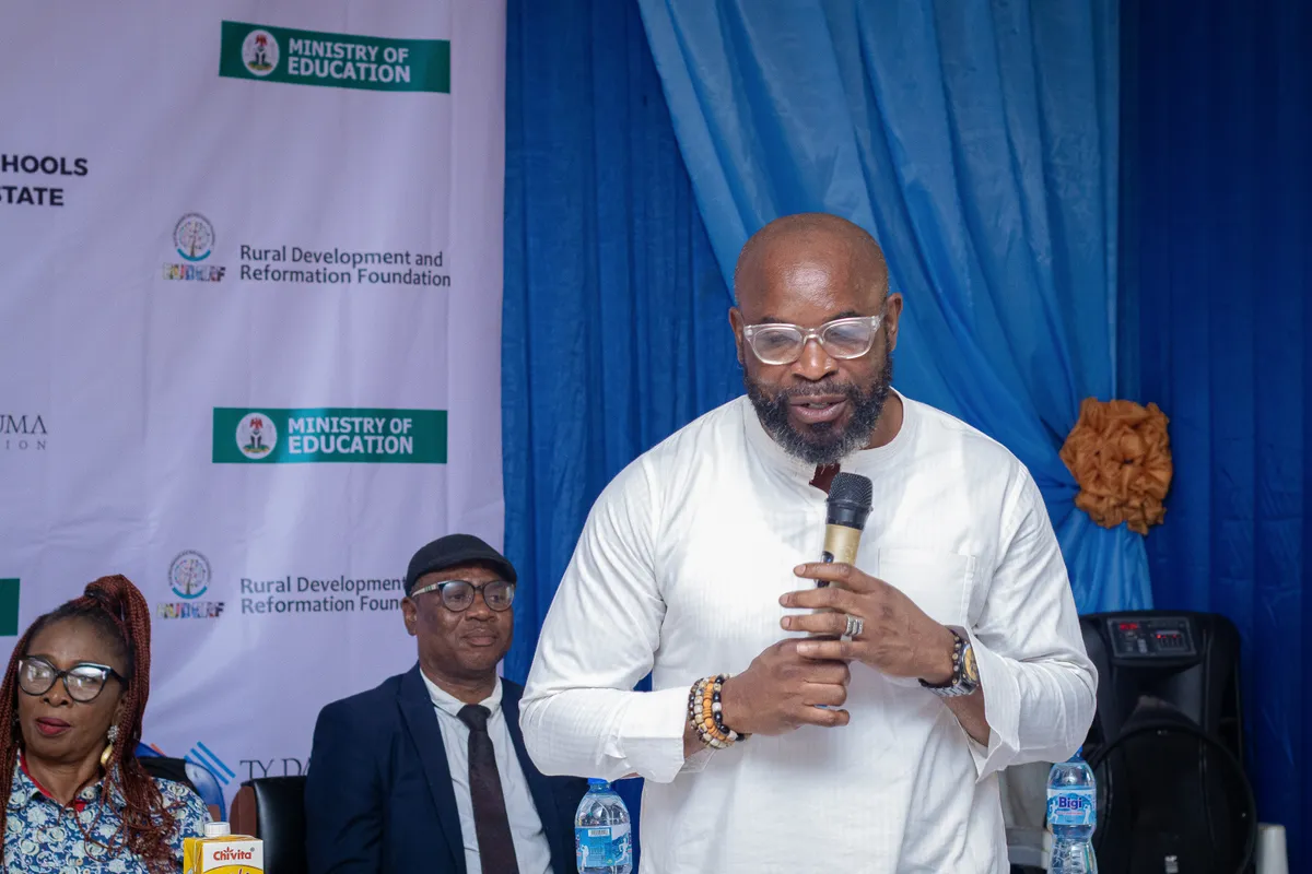 A RUDERF volunteer speaking at an event organized by Ruderf
